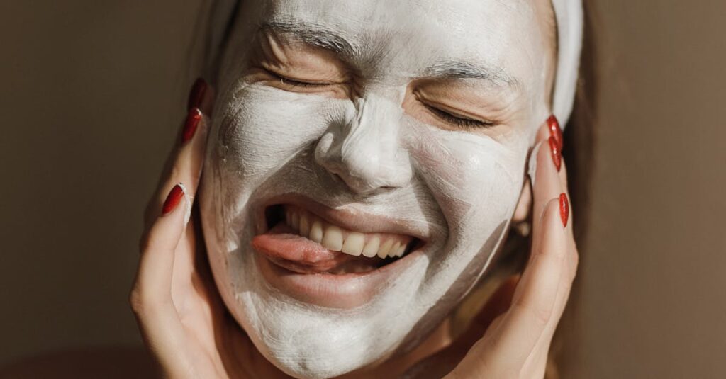 A person applying a clay face mask