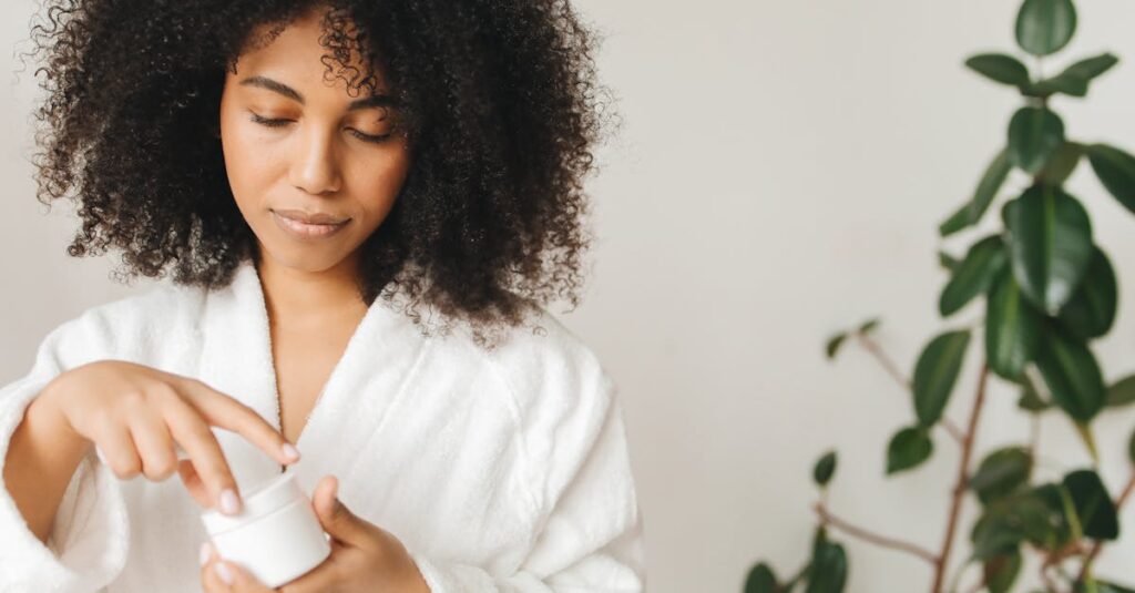 Close-up of a woman applying moisturizer.