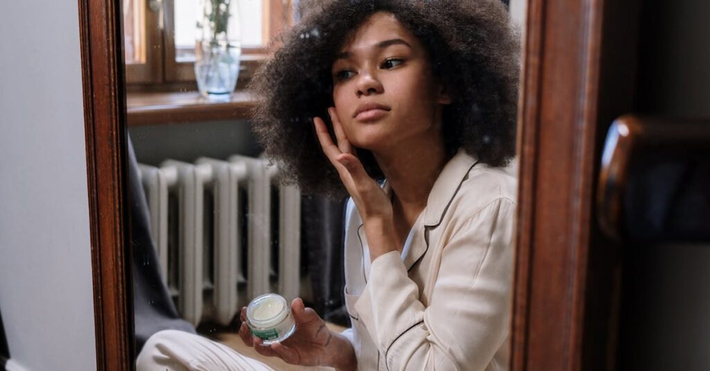 A woman applies skincare cream in a cozy home environment during her morning routine.